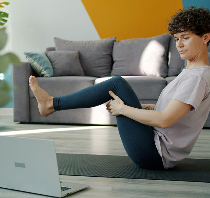 Woman practicing remote fitness